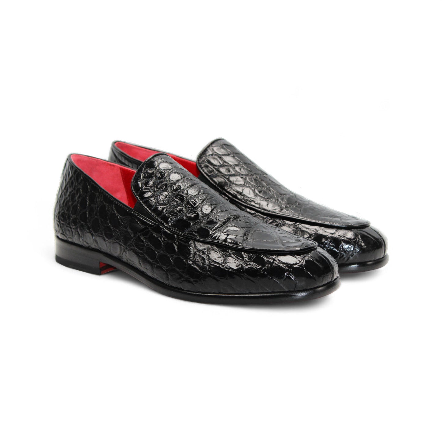 The Fennix Easton Black by Fennix of Italy is a luxury loafer in genuine alligator leather, with a textured black finish, red interior, and fine Italian craftsmanship. Shown in profile on a white background.