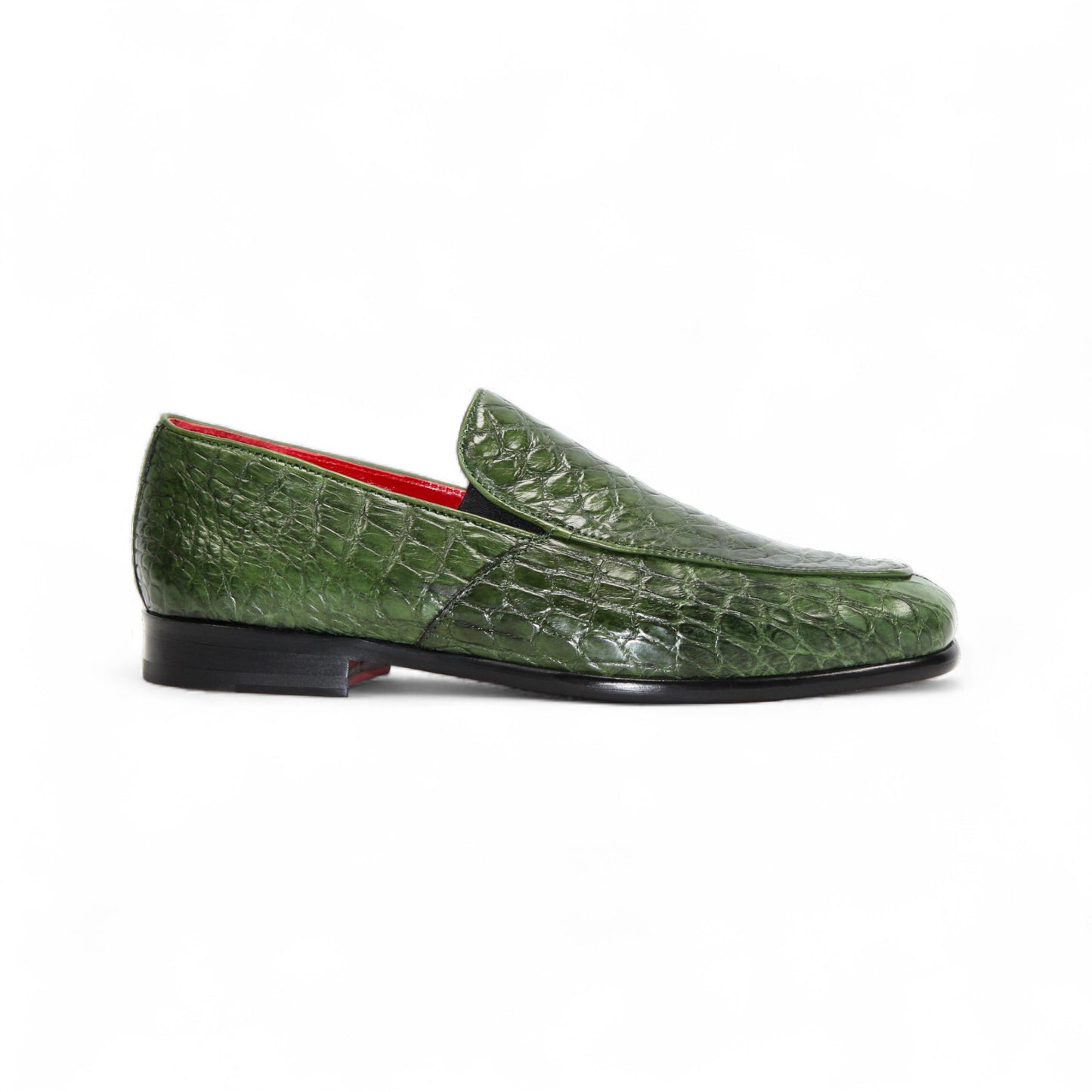 The Fennix of Italy Fennix Easton Green is a green crocodile-patterned leather loafer with Italian craftsmanship, a black sole, and red interior, displayed in side profile on a white background.