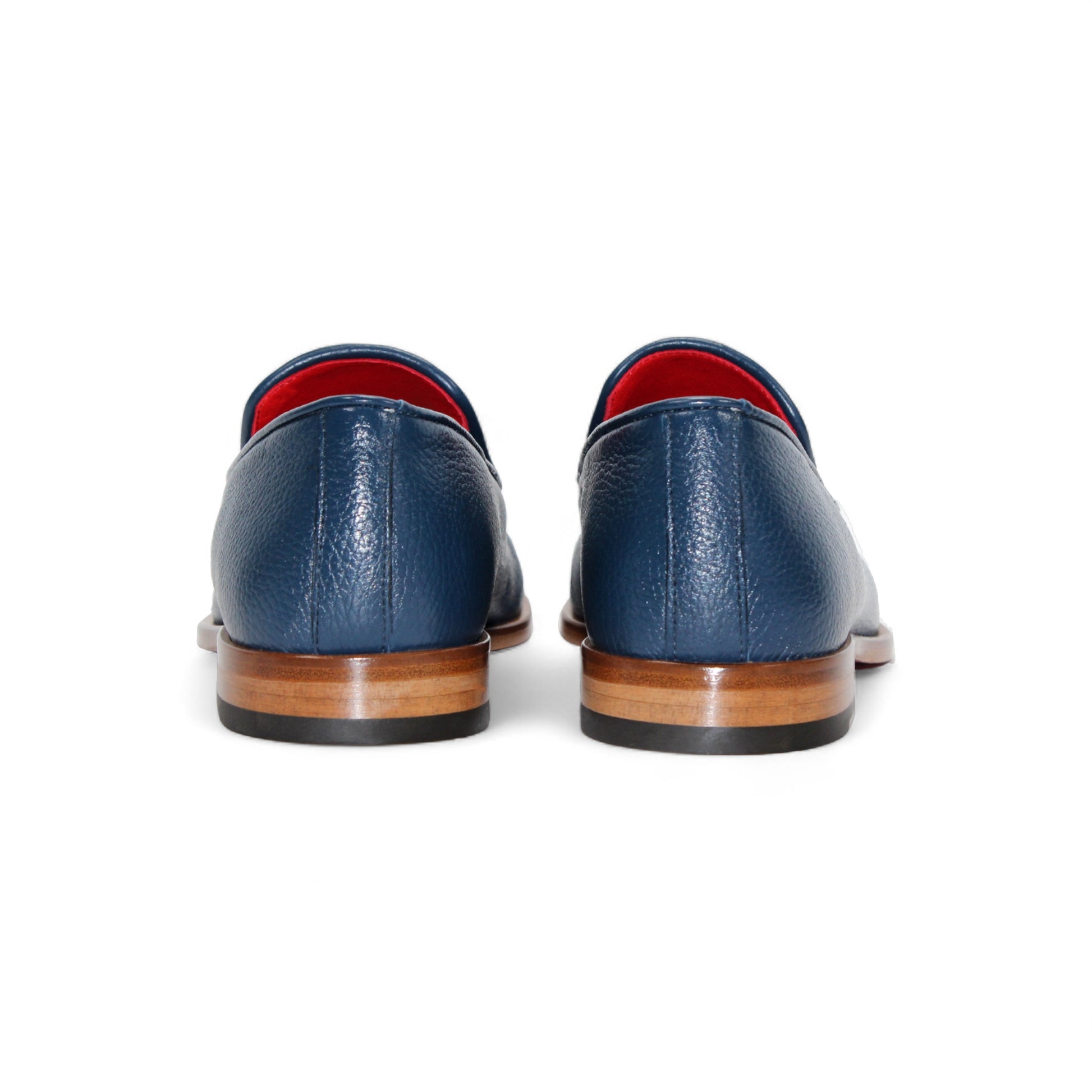 The Emilio Franco Edgardo Jeans is a blue Italian deer skin leather loafer with a wooden sole, metal bit detail, and red interior lining, displayed in profile on a white background. Handcrafted in Italy by Emilio Franco for luxury footwear enthusiasts.
