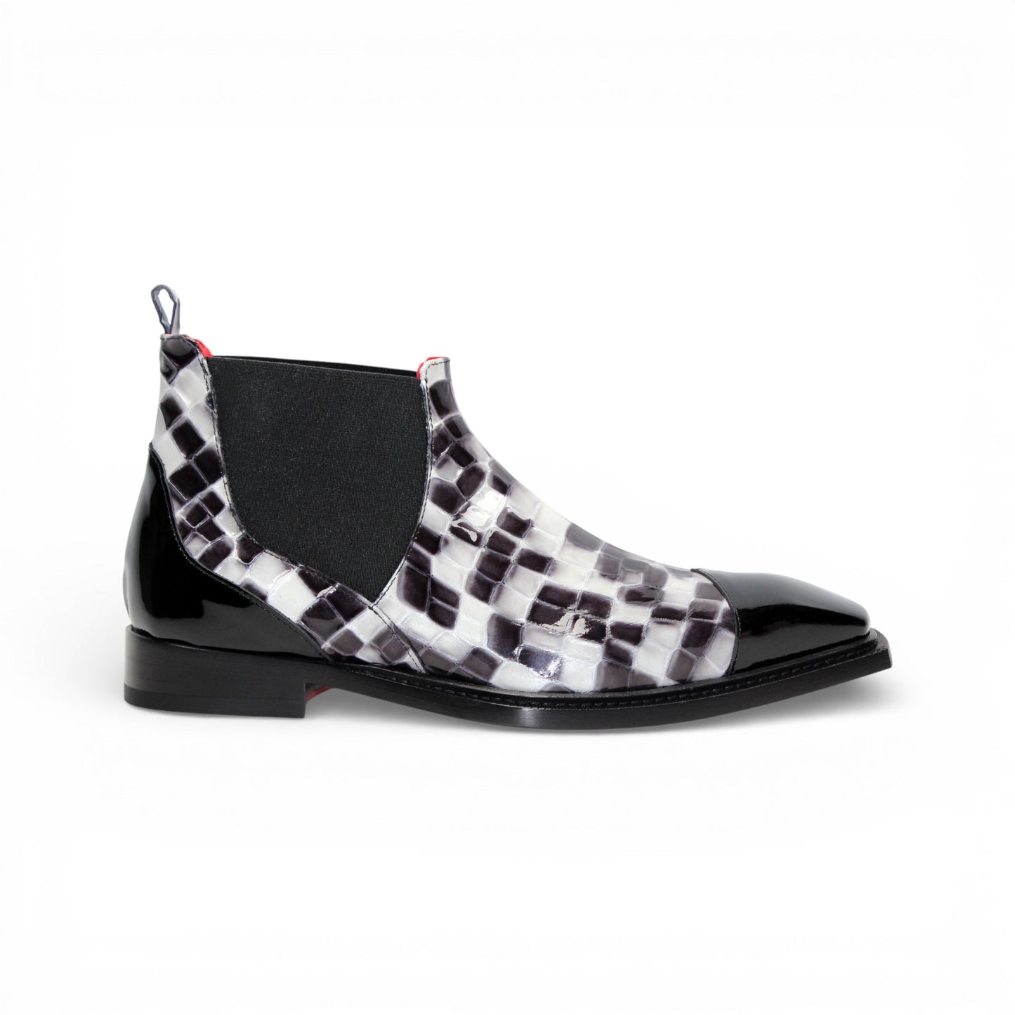 The Emilio Franco Couture EFC352 Black/White Chelsea boot features a black and white checkered design, pointed black Italian patent leather toe, black elastic side panel, and low heel—fashion-forward men's footwear by Emilio Franco Couture.