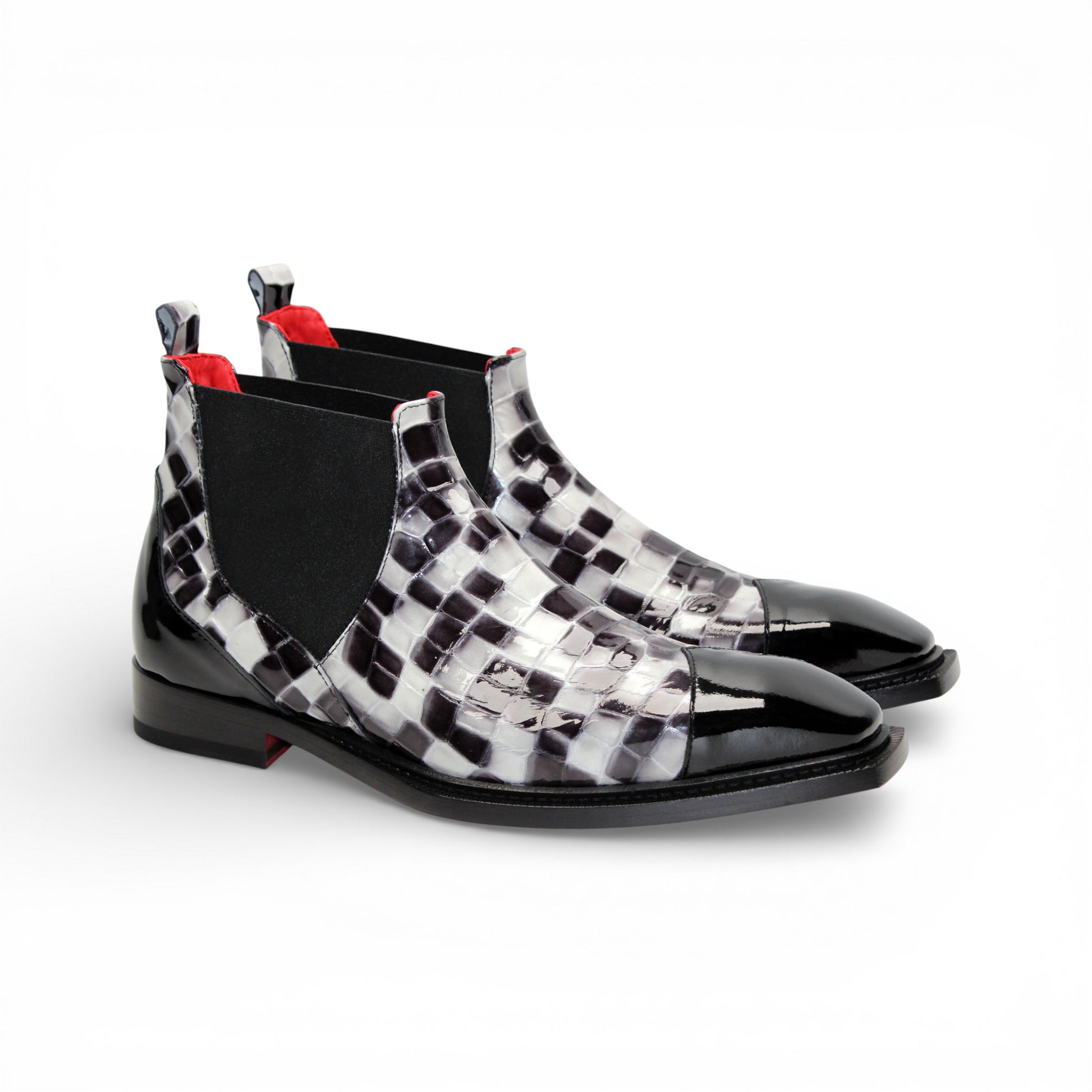 The Emilio Franco Couture EFC352 Black/White Chelsea boot features a black and white checkered design, pointed black Italian patent leather toe, black elastic side panel, and low heel—fashion-forward men's footwear by Emilio Franco Couture.