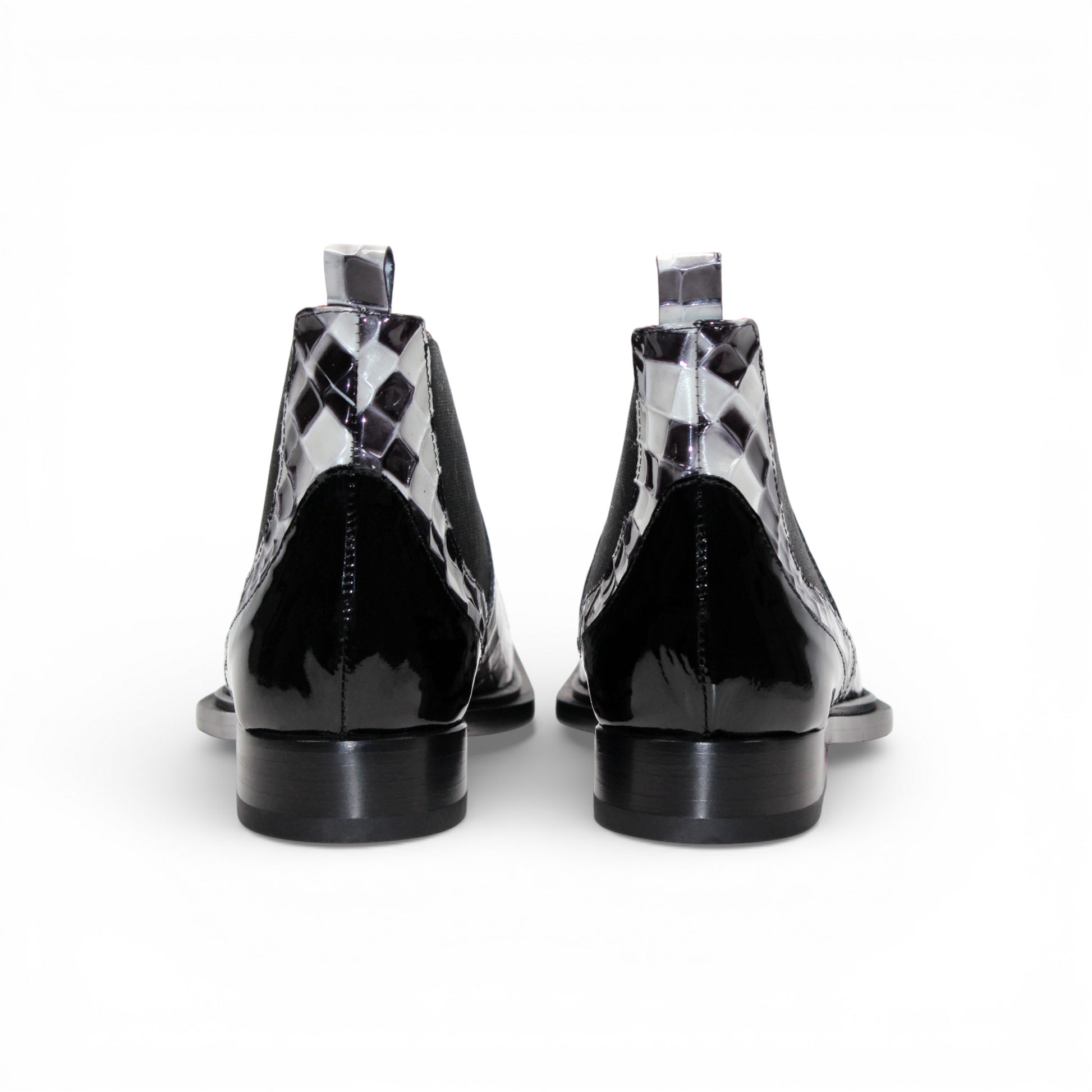 The Emilio Franco Couture EFC352 Black/White Chelsea boot features a black and white checkered design, pointed black Italian patent leather toe, black elastic side panel, and low heel—fashion-forward men's footwear by Emilio Franco Couture.