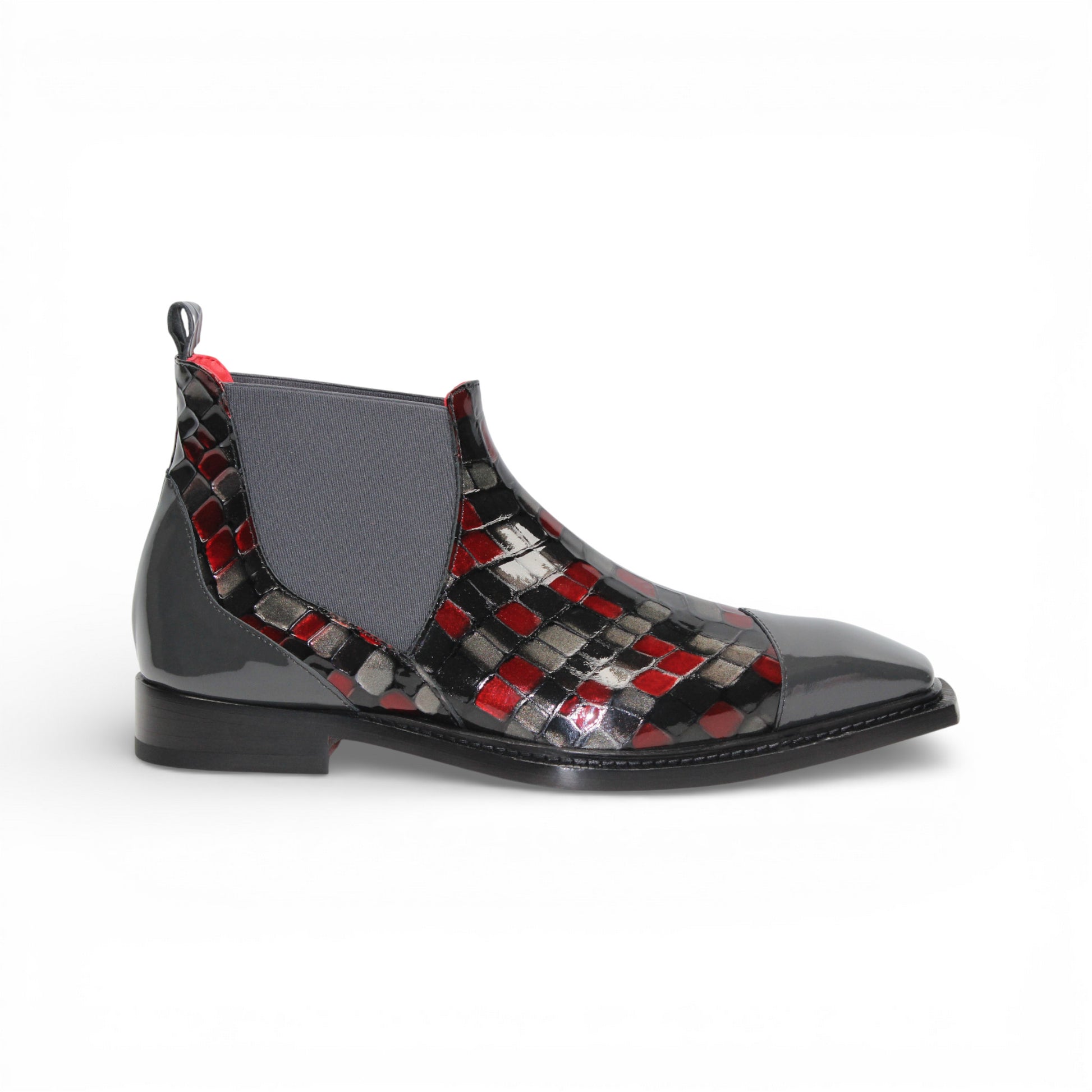 A side view of the Emilio Franco Couture EFC352 Red/Grey Chelsea boot, crafted from patent leather with a black sole, red and black checkered pattern, and an elastic gray side panel by Emilio Franco Couture.