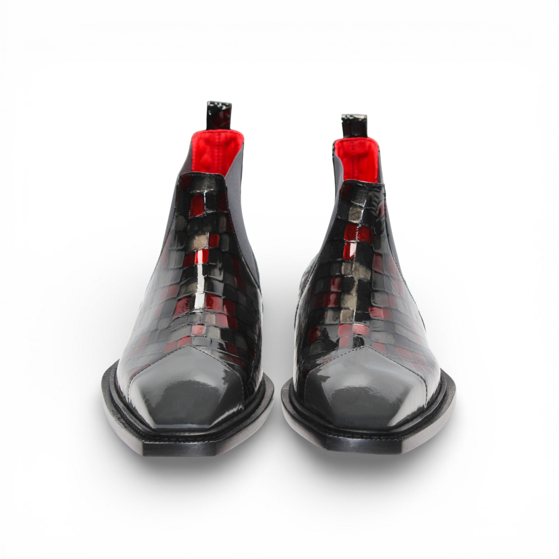 A side view of the Emilio Franco Couture EFC352 Red/Grey Chelsea boot, crafted from patent leather with a black sole, red and black checkered pattern, and an elastic gray side panel by Emilio Franco Couture.