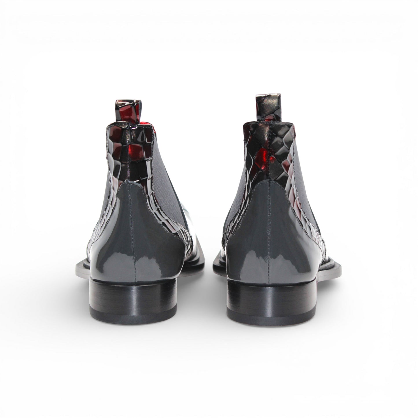 A side view of the Emilio Franco Couture EFC352 Red/Grey Chelsea boot, crafted from patent leather with a black sole, red and black checkered pattern, and an elastic gray side panel by Emilio Franco Couture.