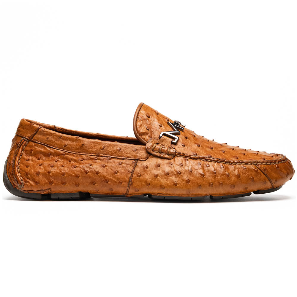 The Bolonia Brandy by Marco Di Milano—brown ostrich leather loafers with hand-painted finishes and metal buckles, one upright and one on its side revealing the sole—exude luxury, crafted from genuine exotic leather.