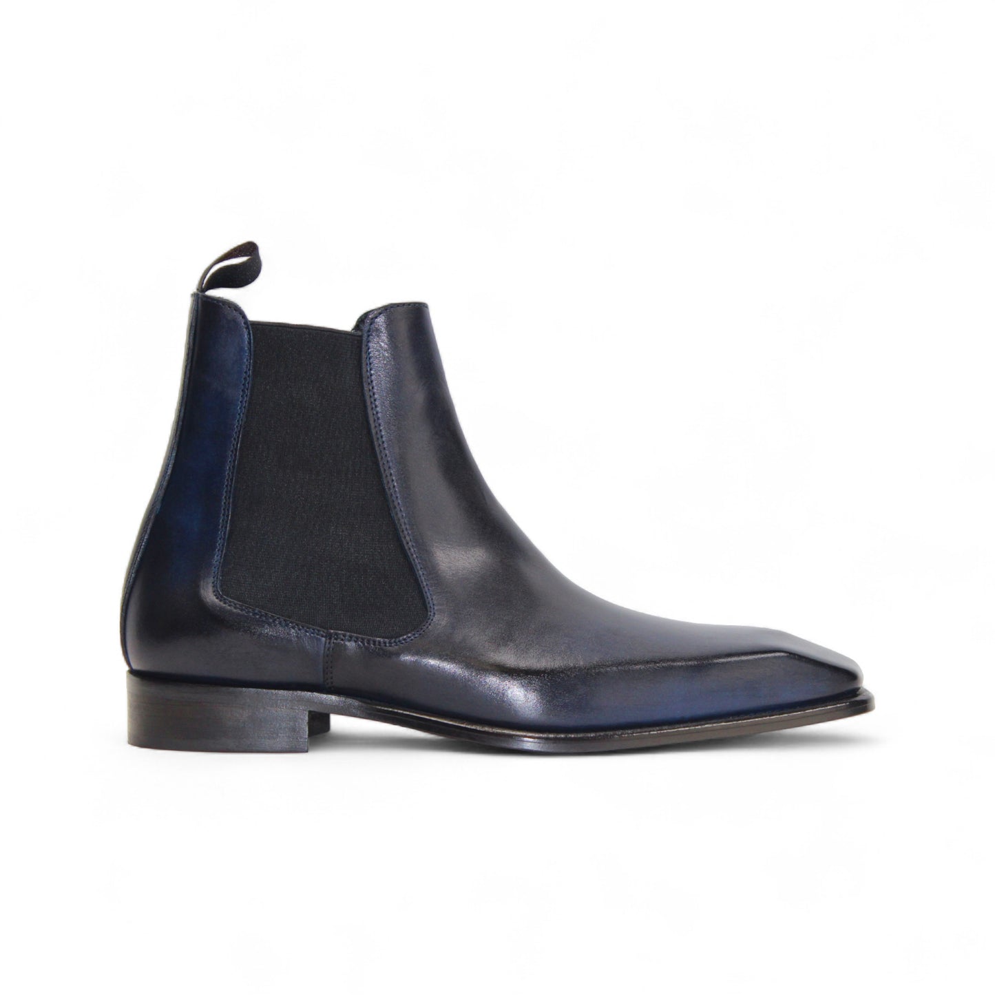 The Duca Empoli Blue by Duca Di Matiste is a dark blue genuine leather Chelsea boot with black elastic side panels and a low heel, featuring classic Italian design, shown on a white background.