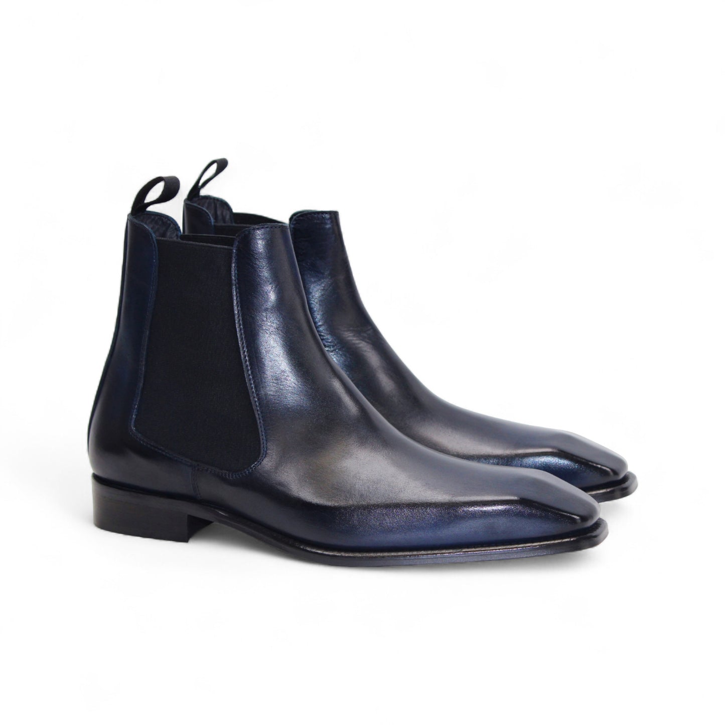 The Duca Empoli Blue by Duca Di Matiste is a dark blue genuine leather Chelsea boot with black elastic side panels and a low heel, featuring classic Italian design, shown on a white background.