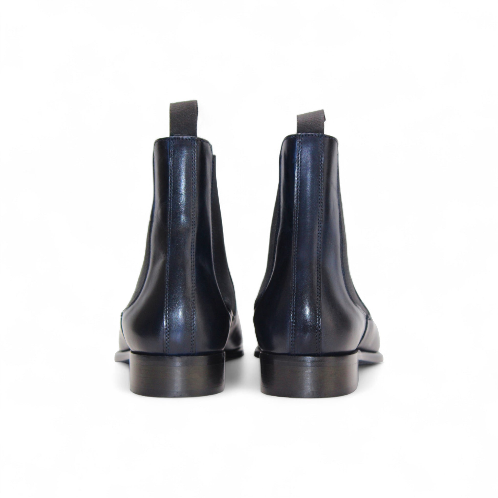 The Duca Empoli Blue by Duca Di Matiste is a dark blue genuine leather Chelsea boot with black elastic side panels and a low heel, featuring classic Italian design, shown on a white background.