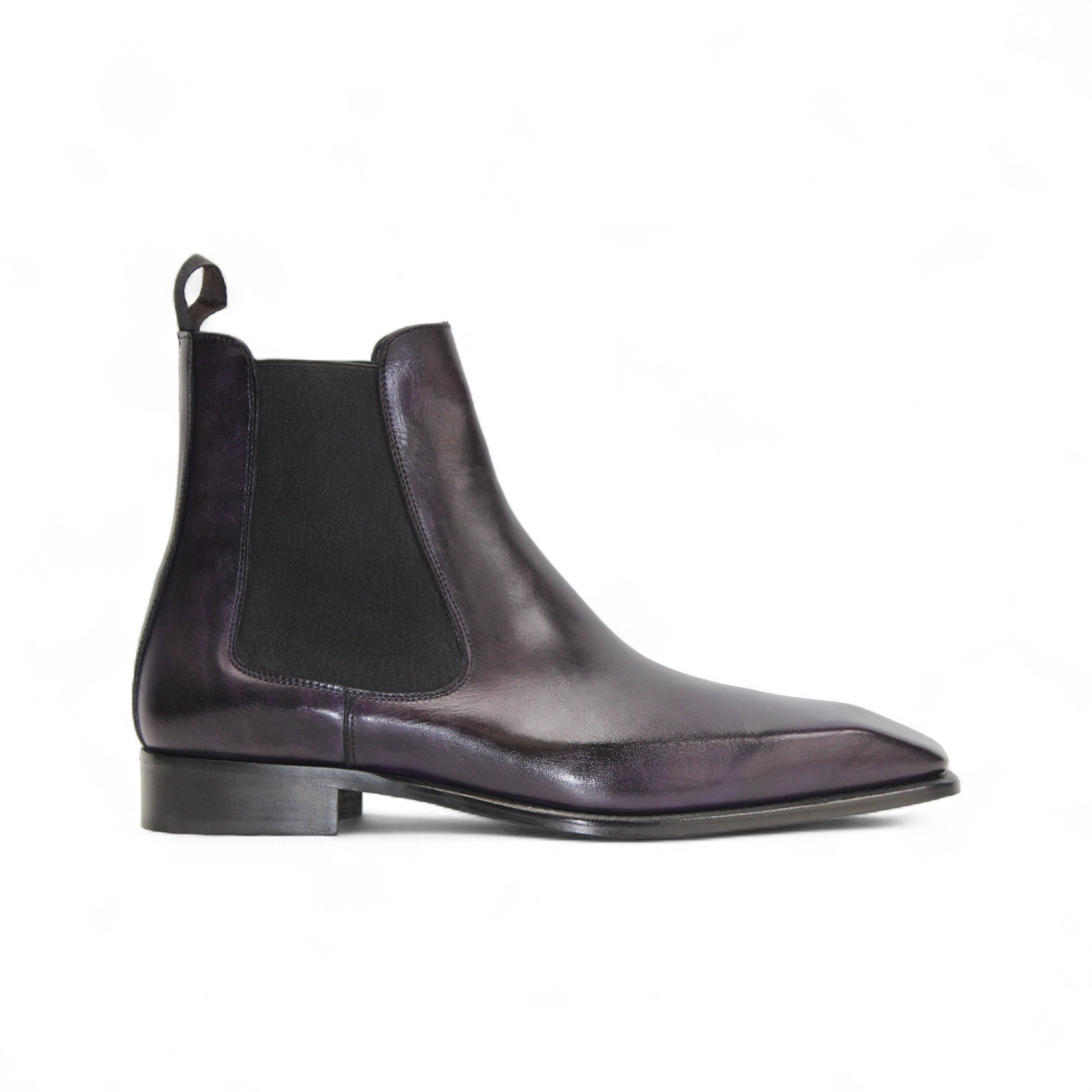 The Duca Empoli Purple by Duca Di Matiste is a dark purple leather Chelsea boot with black elastic side panels, a pull tab, low heel, and pointed toe, shown on a white background.