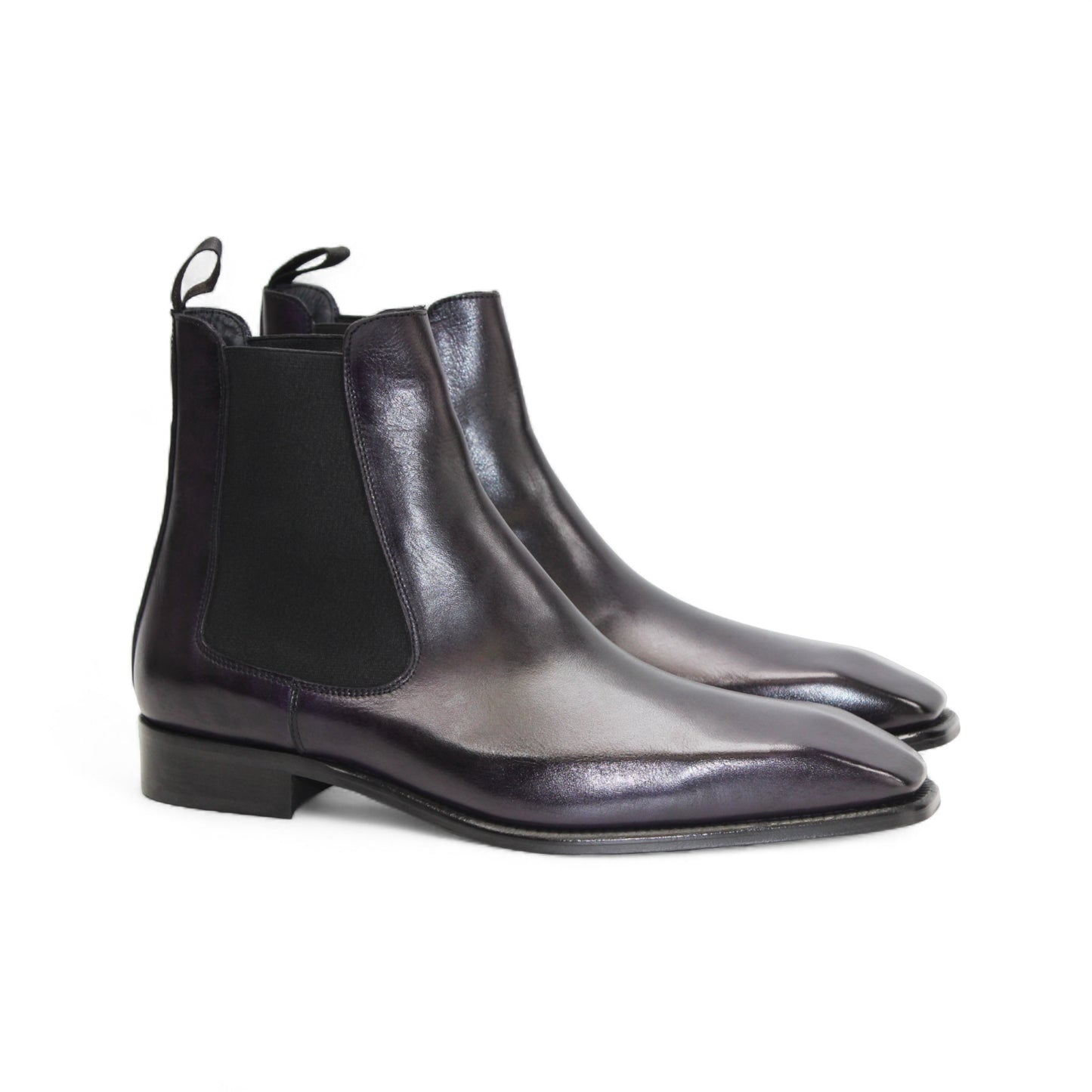 The Duca Empoli Purple by Duca Di Matiste is a dark purple leather Chelsea boot with black elastic side panels, a pull tab, low heel, and pointed toe, shown on a white background.