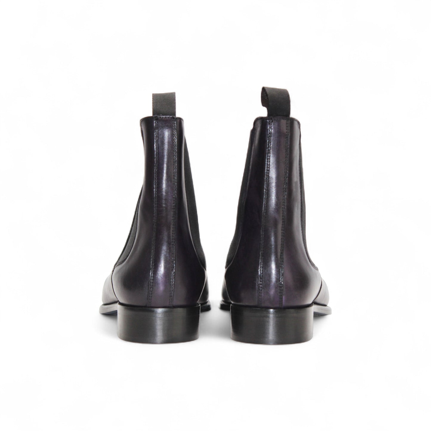 The Duca Empoli Purple by Duca Di Matiste is a dark purple leather Chelsea boot with black elastic side panels, a pull tab, low heel, and pointed toe, shown on a white background.