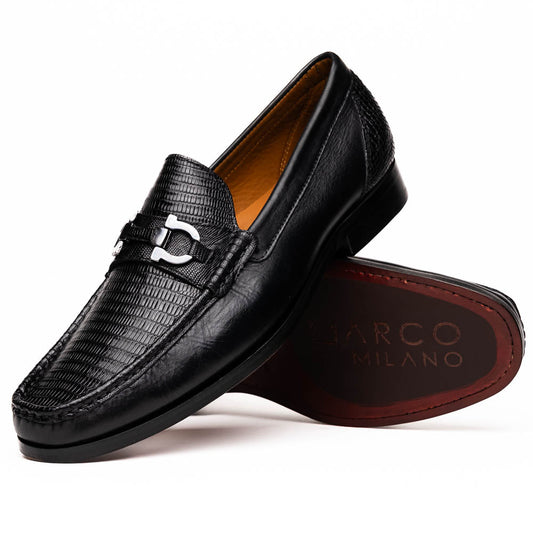 The Enzo Black by Marco Di Milano: black textured genuine lizard loafers with metal bit detail—one upright, one showing a brown sole stamped with "MARCO DI MILANO"—perfect for fans of luxury men's footwear.