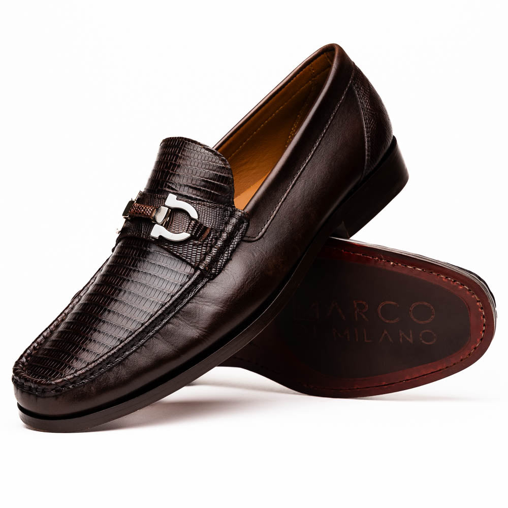 The Enzo Brown by Marco Di Milano features dark brown genuine lizard loafers with textured uppers, a metal buckle, and branded soles—luxurious men's footwear displayed against a white background.