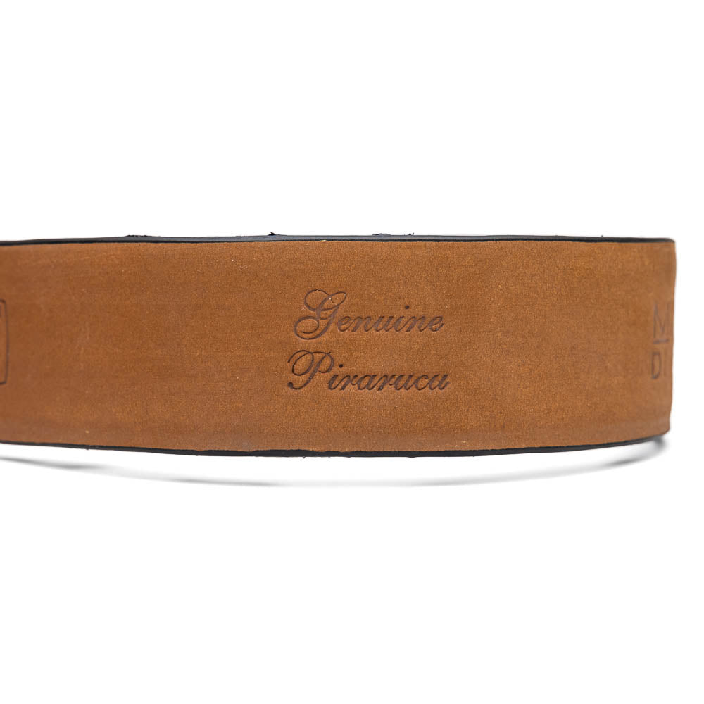 The Olivieri Belt Black by Marco Di Milano is a textured genuine pirarucu belt with a silver buckle, featuring the brand's logo—a refined accessory that pairs seamlessly with Marco Di Milano luxury footwear.