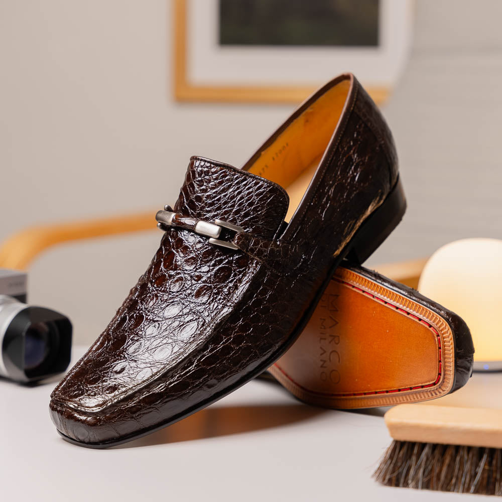 The Fabro-Tin Brown loafers by Marco Di Milano feature dark brown genuine alligator leather, metal bit detail, tan leather soles, and square toes—a true statement in luxury men's footwear.