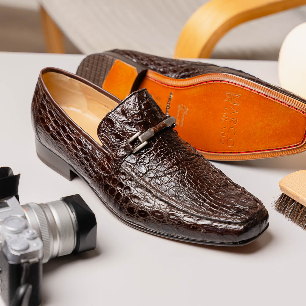 The Fabro-Tin Brown loafers by Marco Di Milano feature dark brown genuine alligator leather, metal bit detail, tan leather soles, and square toes—a true statement in luxury men's footwear.