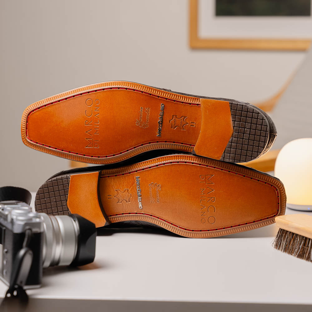 The Fabro-Tin Brown loafers by Marco Di Milano feature dark brown genuine alligator leather, metal bit detail, tan leather soles, and square toes—a true statement in luxury men's footwear.