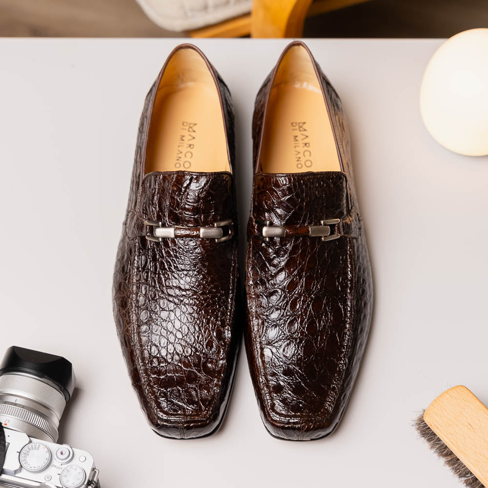 The Fabro-Tin Brown loafers by Marco Di Milano feature dark brown genuine alligator leather, metal bit detail, tan leather soles, and square toes—a true statement in luxury men's footwear.