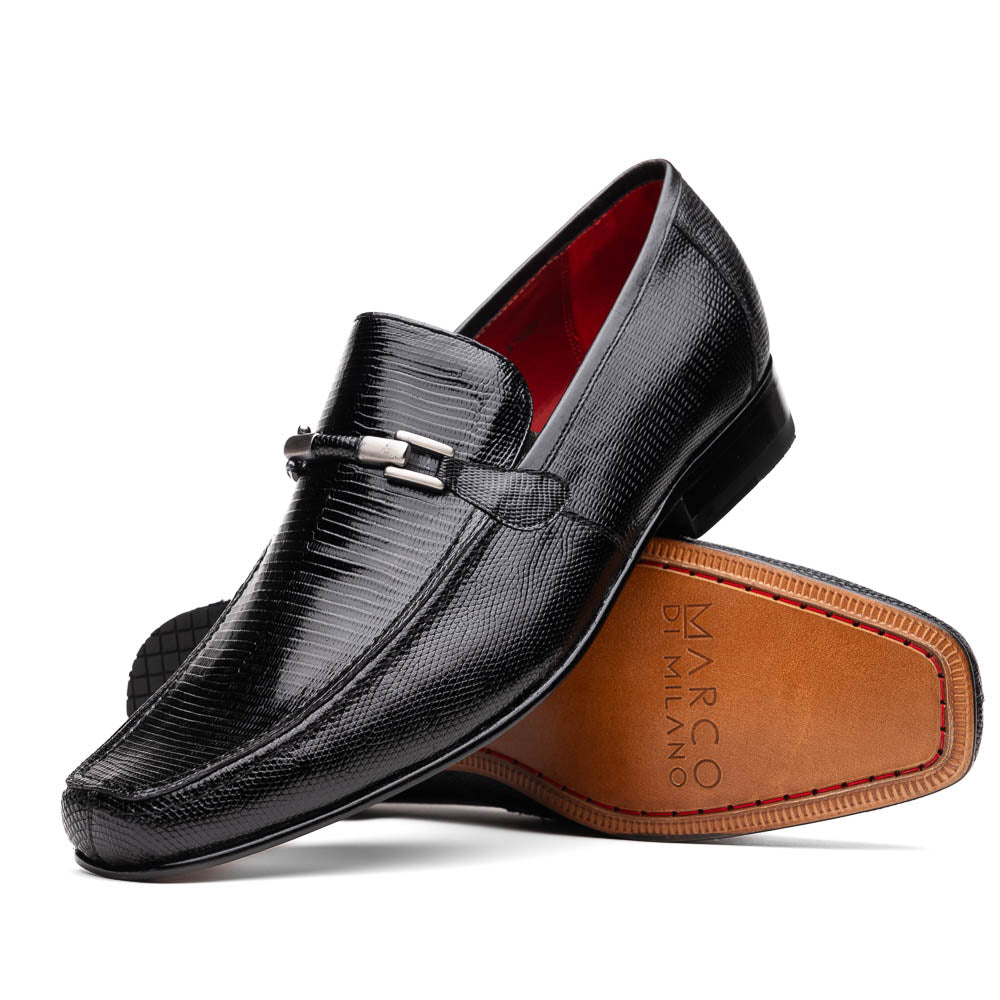 A pair of Marco Di Milano Fabro-Liz Black genuine lizard loafers, featuring textured leather, metal accents, and brown soles—one upright, the other on its side showing the luxury men's shoes branding on the sole.