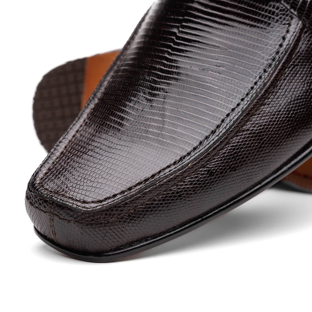 The Marco Di Milano Fabro-Liz Brown loafers feature a textured lizard finish, silver buckle detail, and tan leather soles—ideal for luxury footwear enthusiasts.