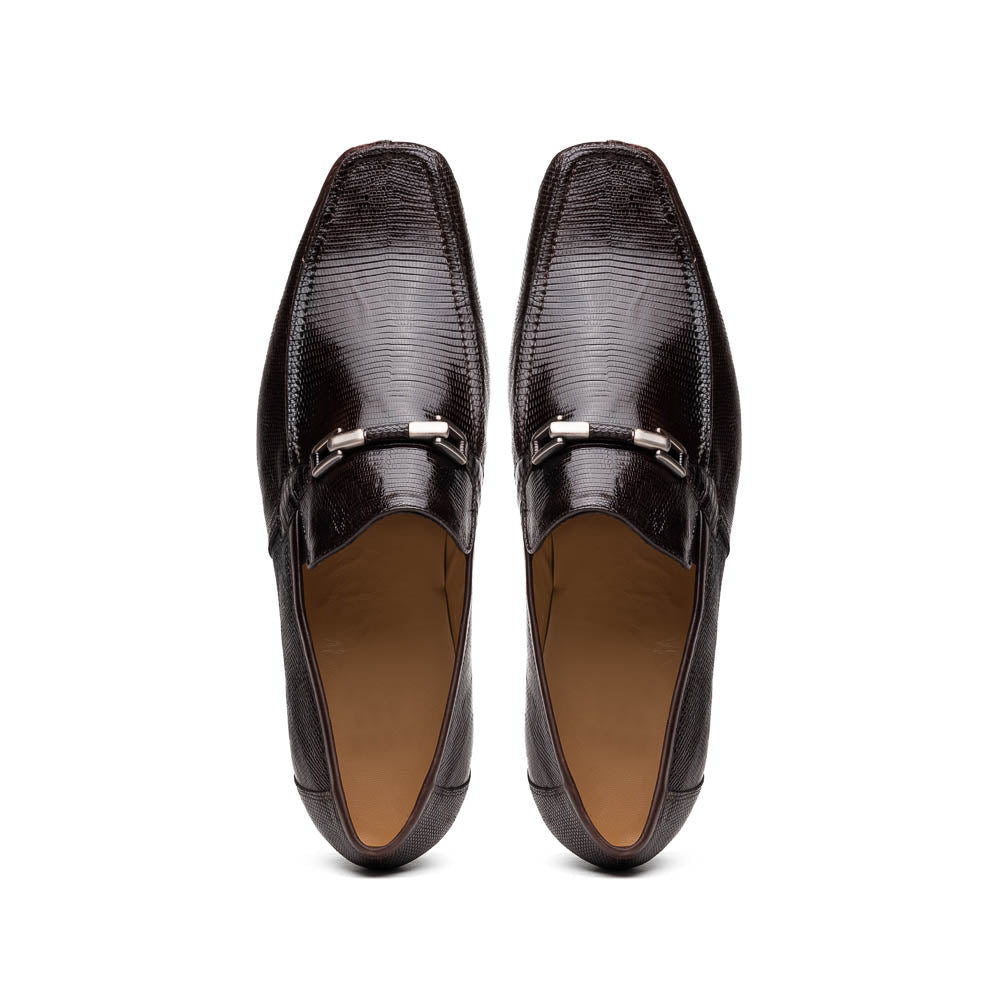 The Marco Di Milano Fabro-Liz Brown loafers feature a textured lizard finish, silver buckle detail, and tan leather soles—ideal for luxury footwear enthusiasts.