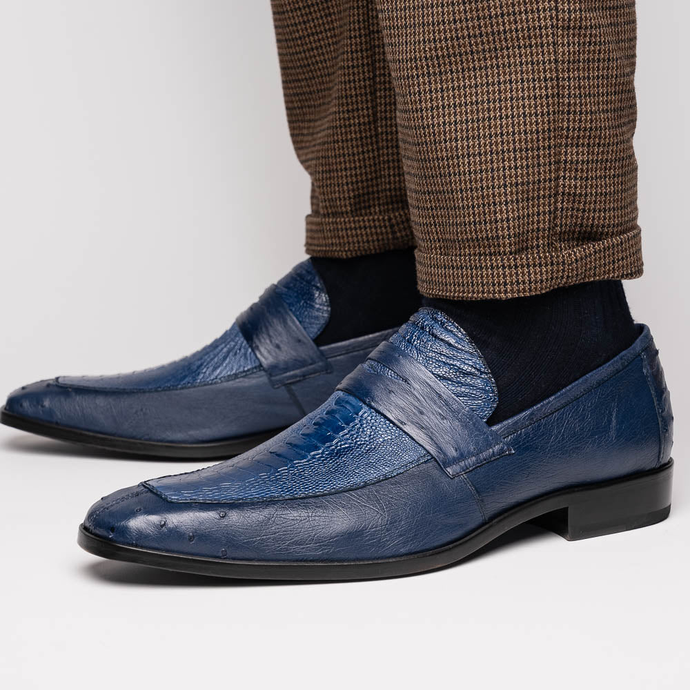 The Marco Di Milano Fangio Denim Blue features genuine ostrich loafers with textured blue uppers and red lining—one upright, one on its side displaying the sole—a standout addition to any luxury men’s footwear collection.