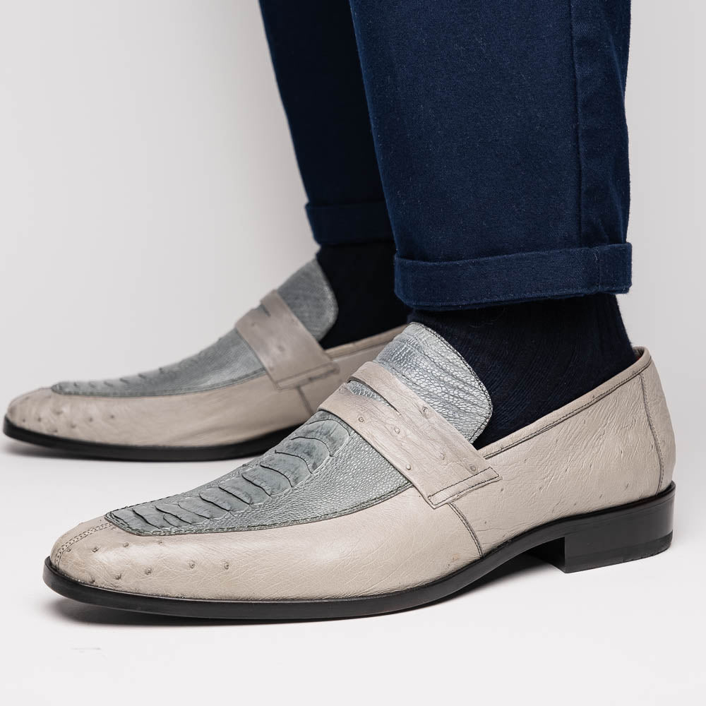 A pair of Marco Di Milano Fangio Gray formal slip-on dress shoes with textured leather and a hand-painted finish, one upright and the other on its side displaying the sole.