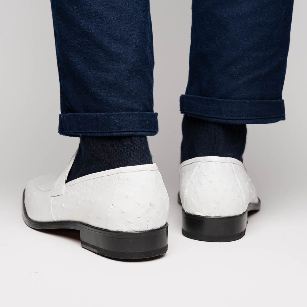 The Marco Di Milano Fangio White men's loafers feature luxurious white genuine ostrich leather with a textured finish; one stands upright, the other on its side to showcase a rich brown leather sole.