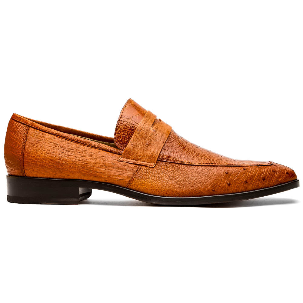 A pair of Marco Di Milano Fangio Cognac men's shoes in brown leather with textured detailing; one genuine ostrich loafer stands upright, while the other lies on its side showing the sole embossed with the brand name.