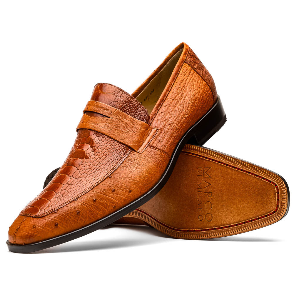 A pair of Marco Di Milano Fangio Cognac men's shoes in brown leather with textured detailing; one genuine ostrich loafer stands upright, while the other lies on its side showing the sole embossed with the brand name.