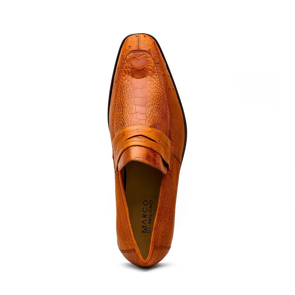 A pair of Marco Di Milano Fangio Cognac men's shoes in brown leather with textured detailing; one genuine ostrich loafer stands upright, while the other lies on its side showing the sole embossed with the brand name.