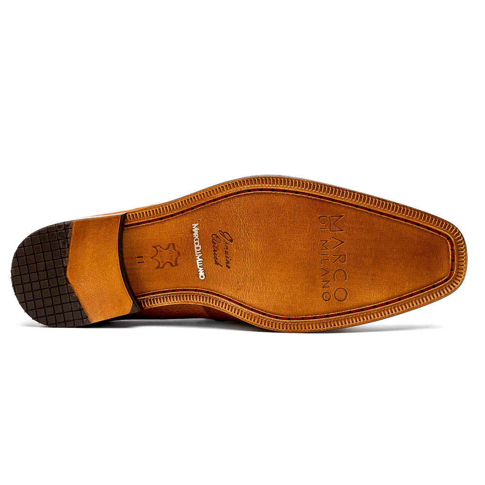A pair of Marco Di Milano Fangio Cognac men's shoes in brown leather with textured detailing; one genuine ostrich loafer stands upright, while the other lies on its side showing the sole embossed with the brand name.