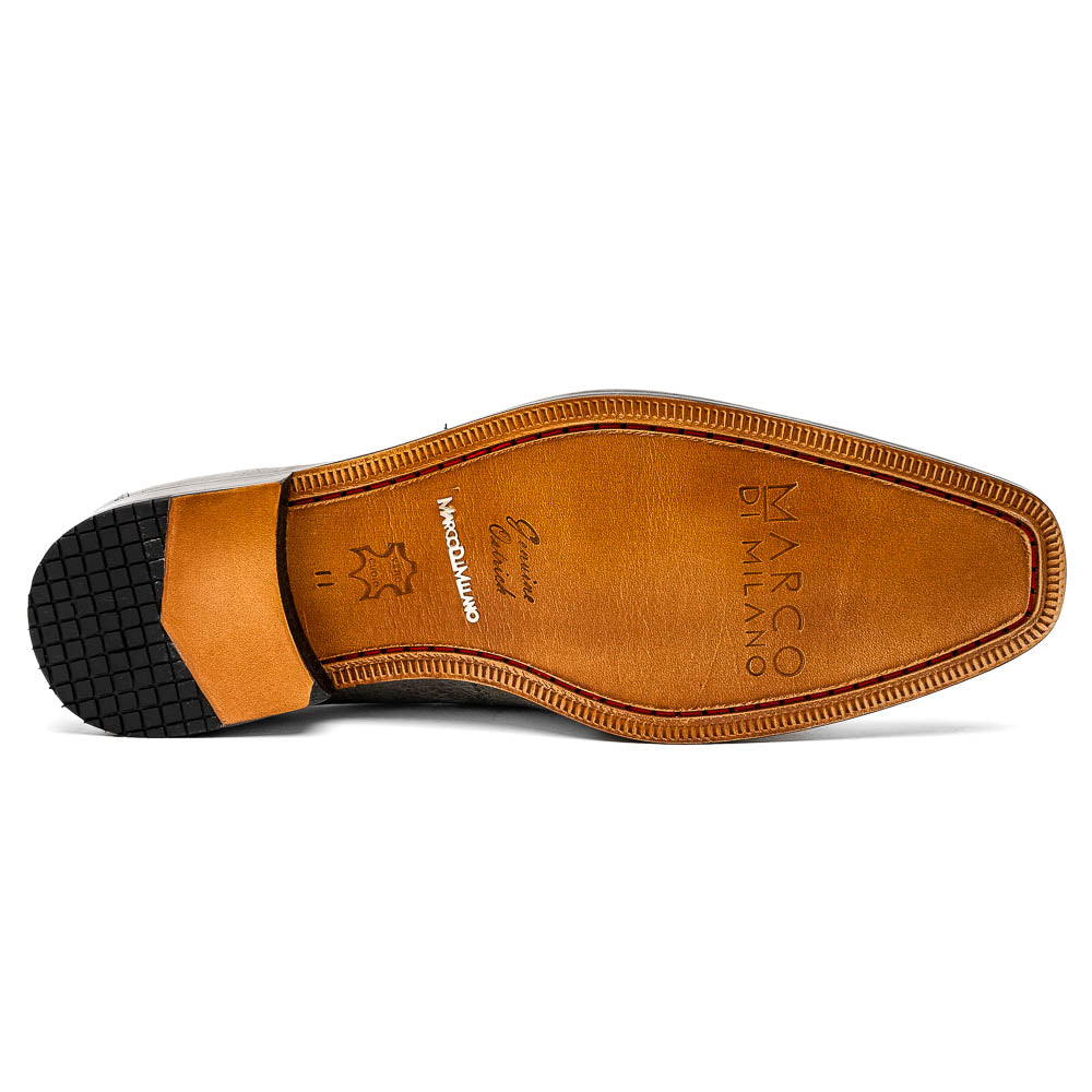 The Fangio Serpentine Gray by Marco Di Milano features gray textured leather in classic penny loafer style, with detailed stitching and tan leather soles—one shoe upright, one on its side—to showcase refined craftsmanship.