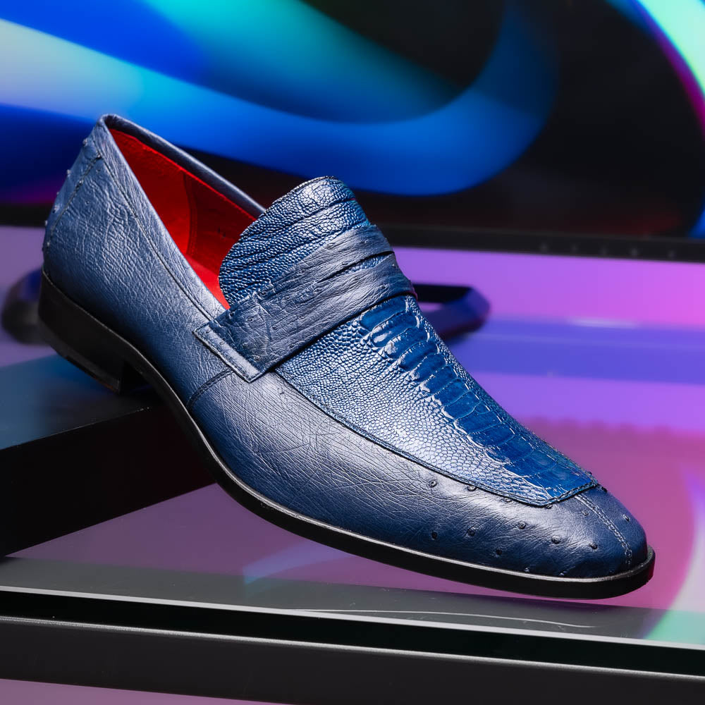 The Marco Di Milano Fangio Denim Blue features genuine ostrich loafers with textured blue uppers and red lining—one upright, one on its side displaying the sole—a standout addition to any luxury men’s footwear collection.