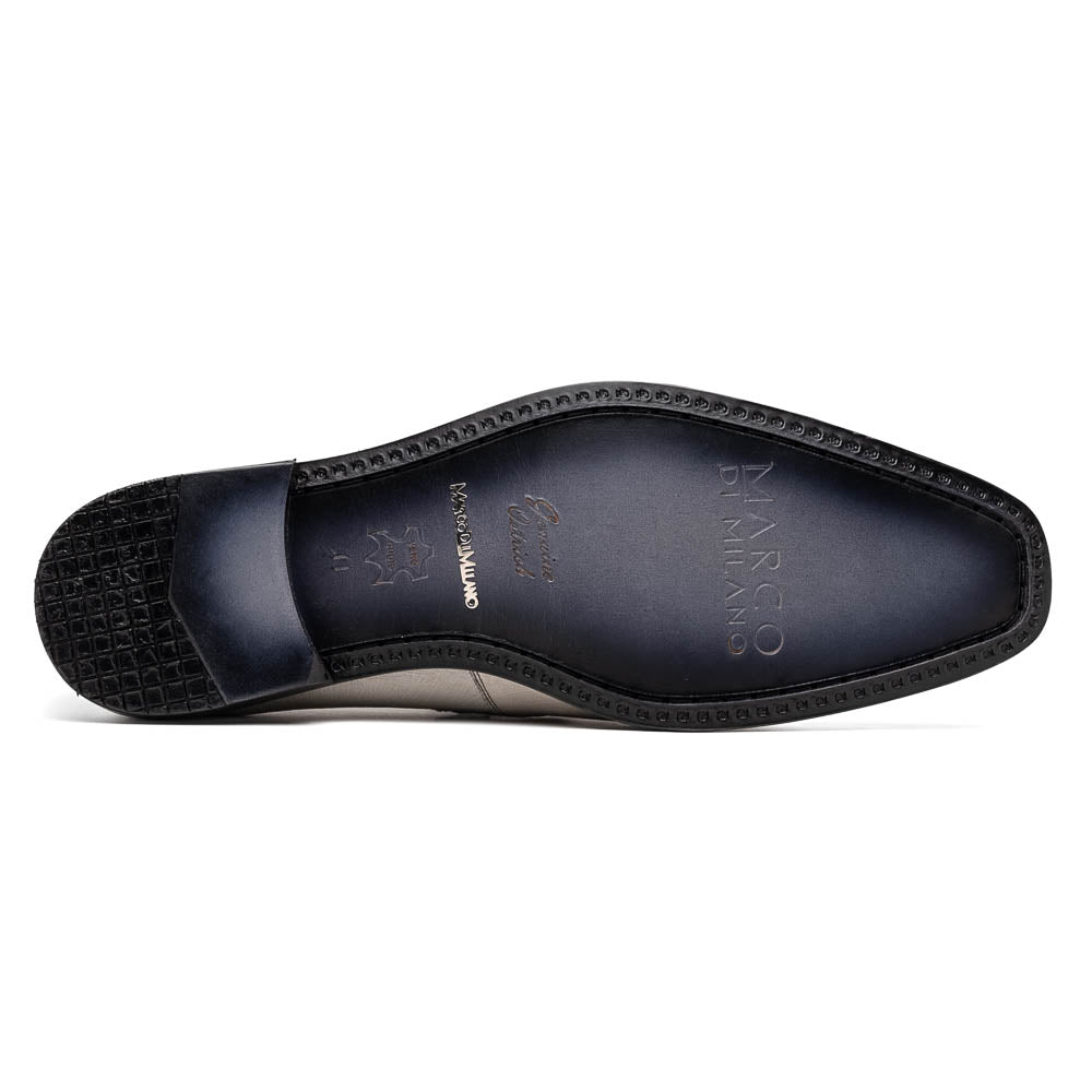 A pair of Marco Di Milano Fangio Gray formal slip-on dress shoes with textured leather and a hand-painted finish, one upright and the other on its side displaying the sole.