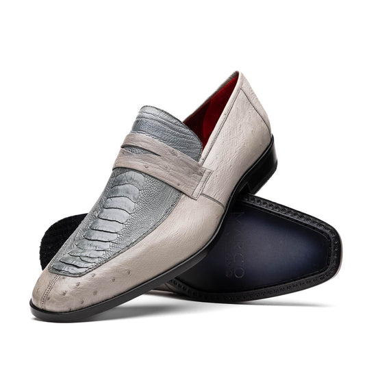 A pair of Marco Di Milano Fangio Gray formal slip-on dress shoes with textured leather and a hand-painted finish, one upright and the other on its side displaying the sole.