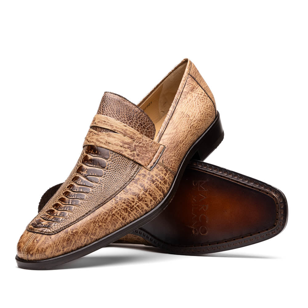 The Fangio Orix by Marco Di Milano: tan textured genuine ostrich loafers with dark brown soles, one upright and one on its side to display the sole—luxury men's shoes with hand-painted finishes.
