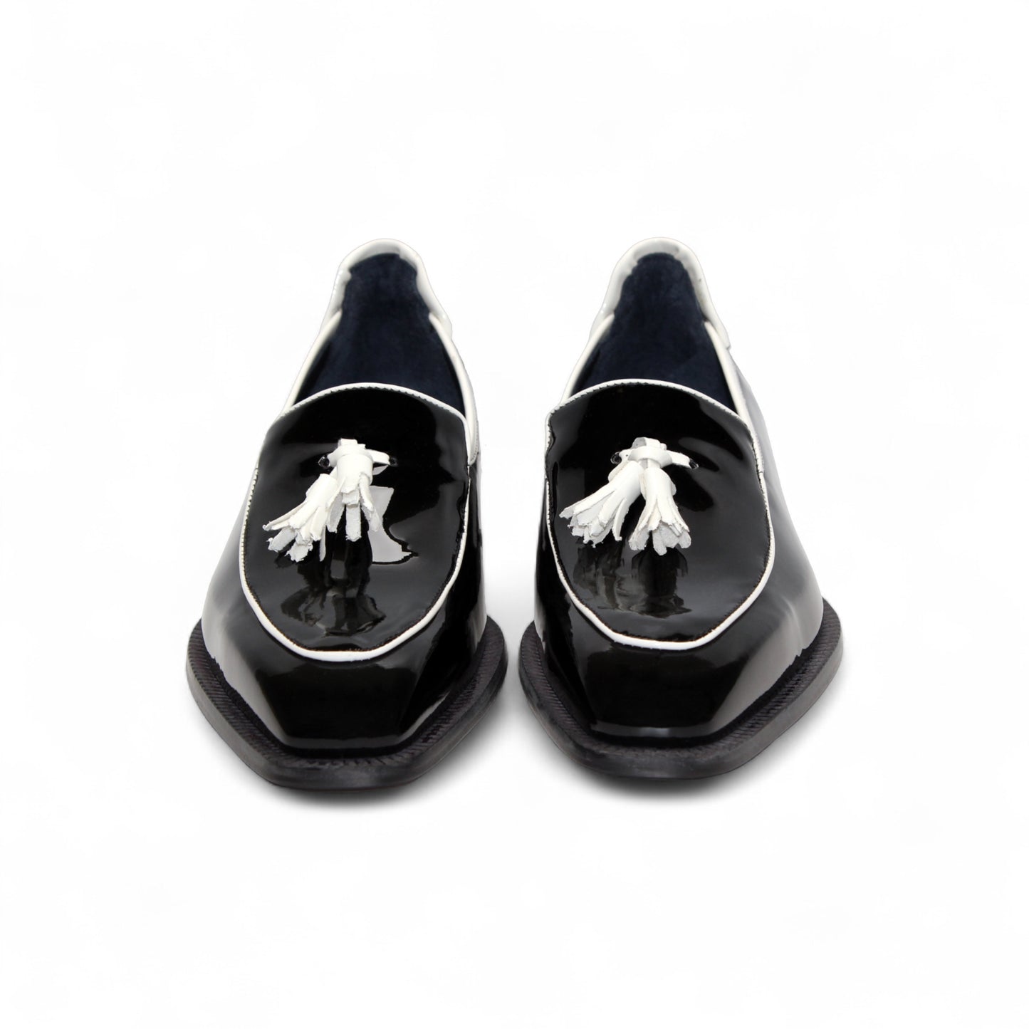 The Duca Di Matiste Duca Fano Black/White is a black patent leather loafer with white trim and tassel detail, shown in profile against a plain white background—an elegant luxury men’s footwear choice.