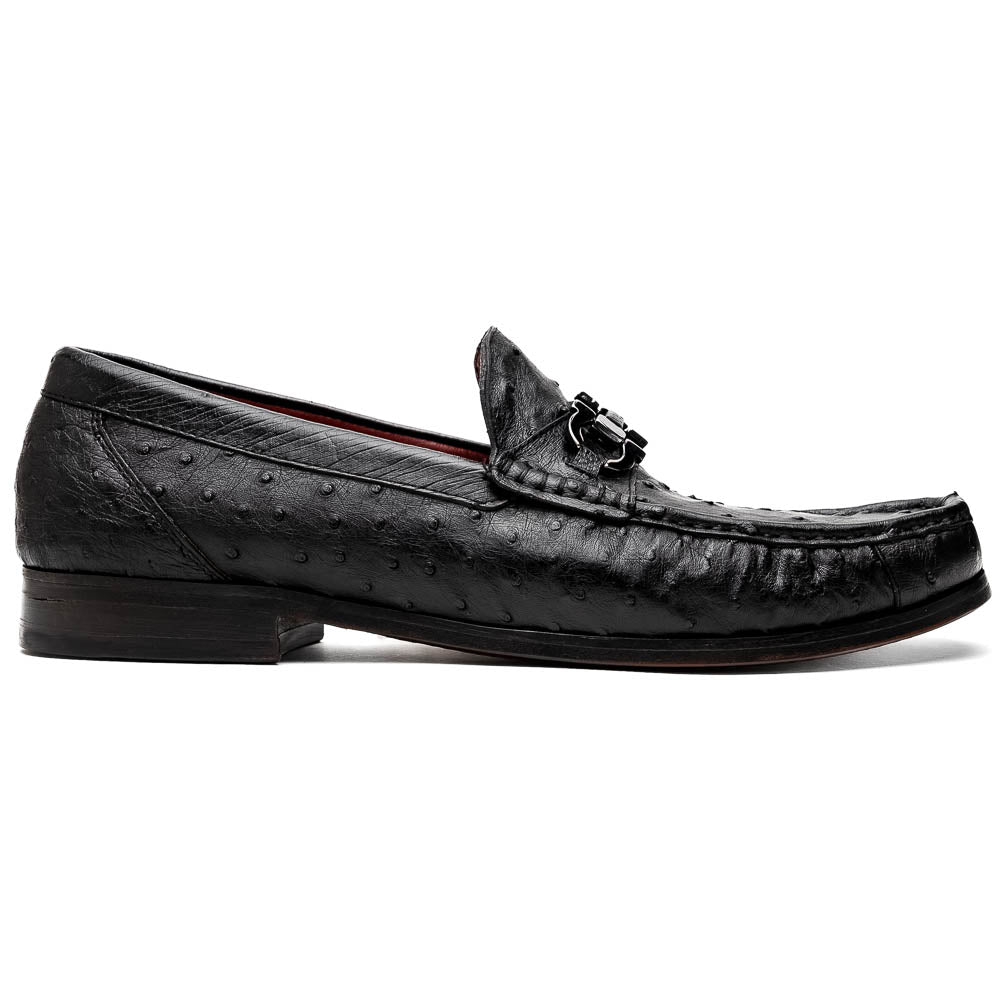 The Marco Di Milano Ferrioni Black: luxury men's loafers in genuine ostrich leather with metal buckles and brown soles, shown both upright and on their side to highlight the branding.
