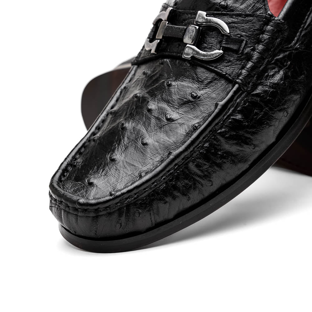 The Marco Di Milano Ferrioni Black: luxury men's loafers in genuine ostrich leather with metal buckles and brown soles, shown both upright and on their side to highlight the branding.