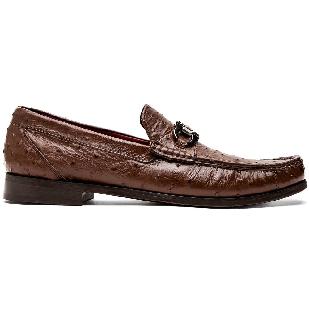 Experience luxury with the Ferrioni Kango Tabac by Marco Di Milano—brown leather men's loafers featuring a textured finish, metal buckle detail, and signature branding on the sole.