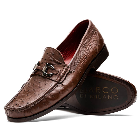 Experience luxury with the Ferrioni Kango Tabac by Marco Di Milano—brown leather men's loafers featuring a textured finish, metal buckle detail, and signature branding on the sole.