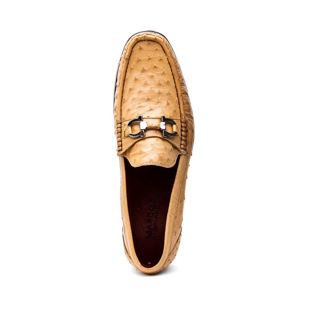 The Marco Di Milano Ferrioni Orix is a pair of genuine beige ostrich loafers with a classic bit buckle, one upright and one on its side showing the insole logo—timeless luxury men's footwear.