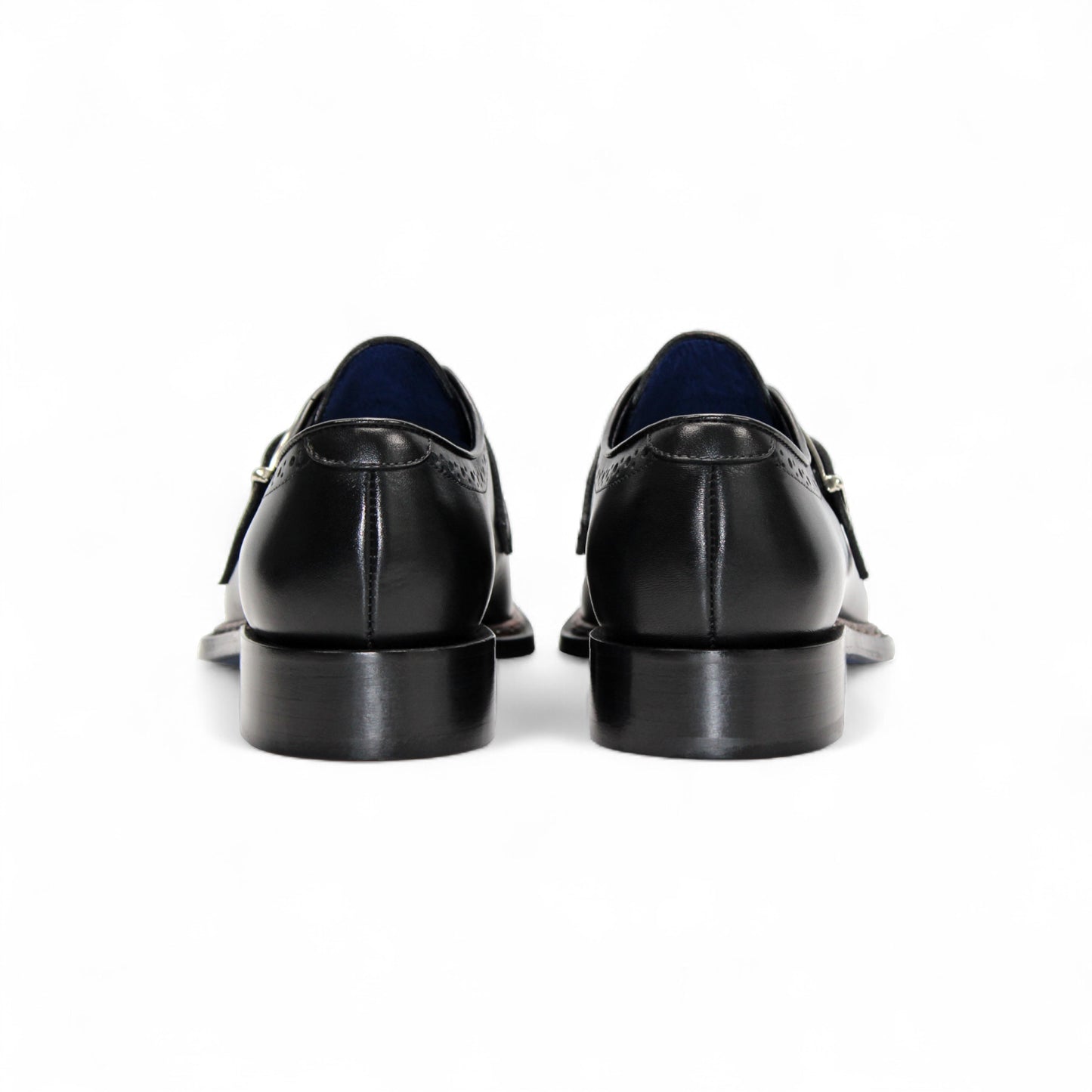 The Emilio Franco Filippo Black is a black Italian leather dress shoe with a single buckle, decorative perforations, and a low heel by Emilio Franco, crafted in Italy and displayed in profile against a white background.