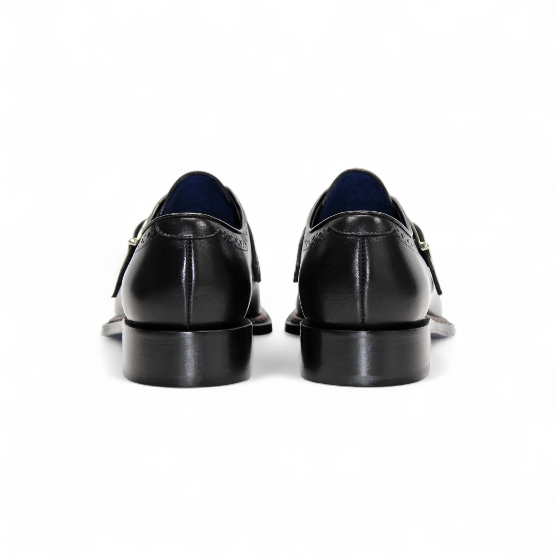 The Emilio Franco Filippo Black is a black Italian leather dress shoe with a single buckle, decorative perforations, and a low heel by Emilio Franco, crafted in Italy and displayed in profile against a white background.