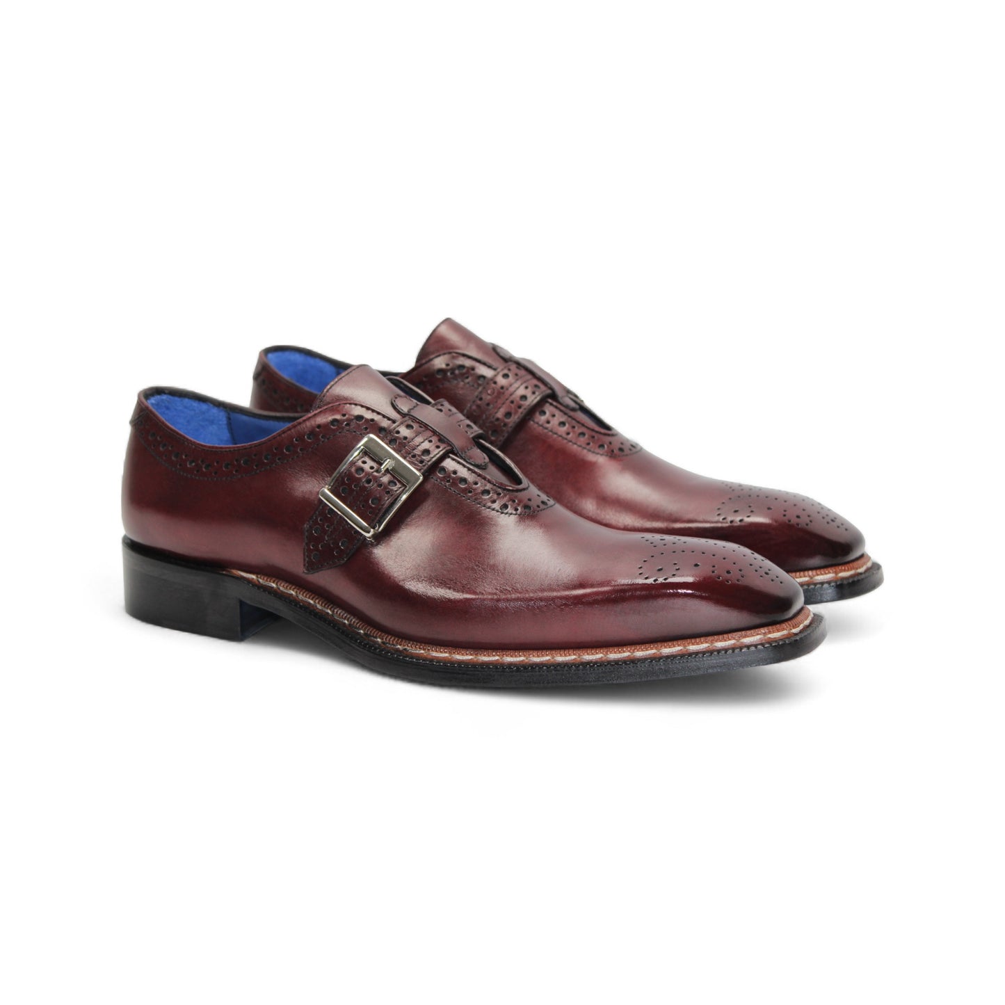 The Emilio Franco Filippo Burgundy is a single burgundy leather dress shoe with a buckle strap, brogue detailing, and a low black heel, crafted from genuine leather to showcase Italian craftsmanship.