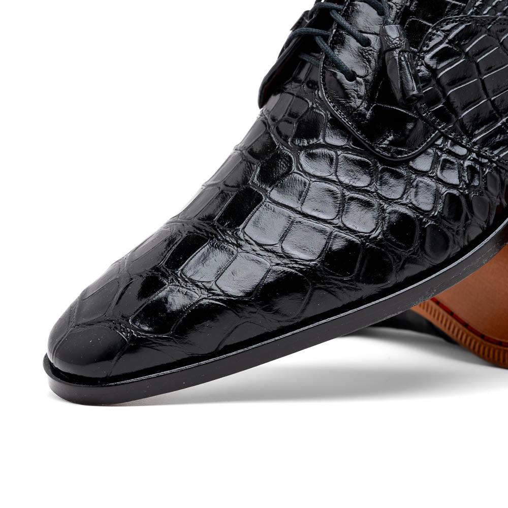 The Fitipaldi Black by Marco Di Milano: luxury black crocodile-patterned leather dress shoes with laces, one upright and one sole up to reveal a hand-painted orange-brown sole.