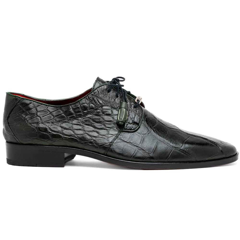 A pair of Fitipaldi Olive luxury footwear by Marco Di Milano in black crocodile leather—one shoe upright, the other showing a tan sole with "Marco Di Milano" embossed—crafted with hand-painted finishes for an elegant touch.