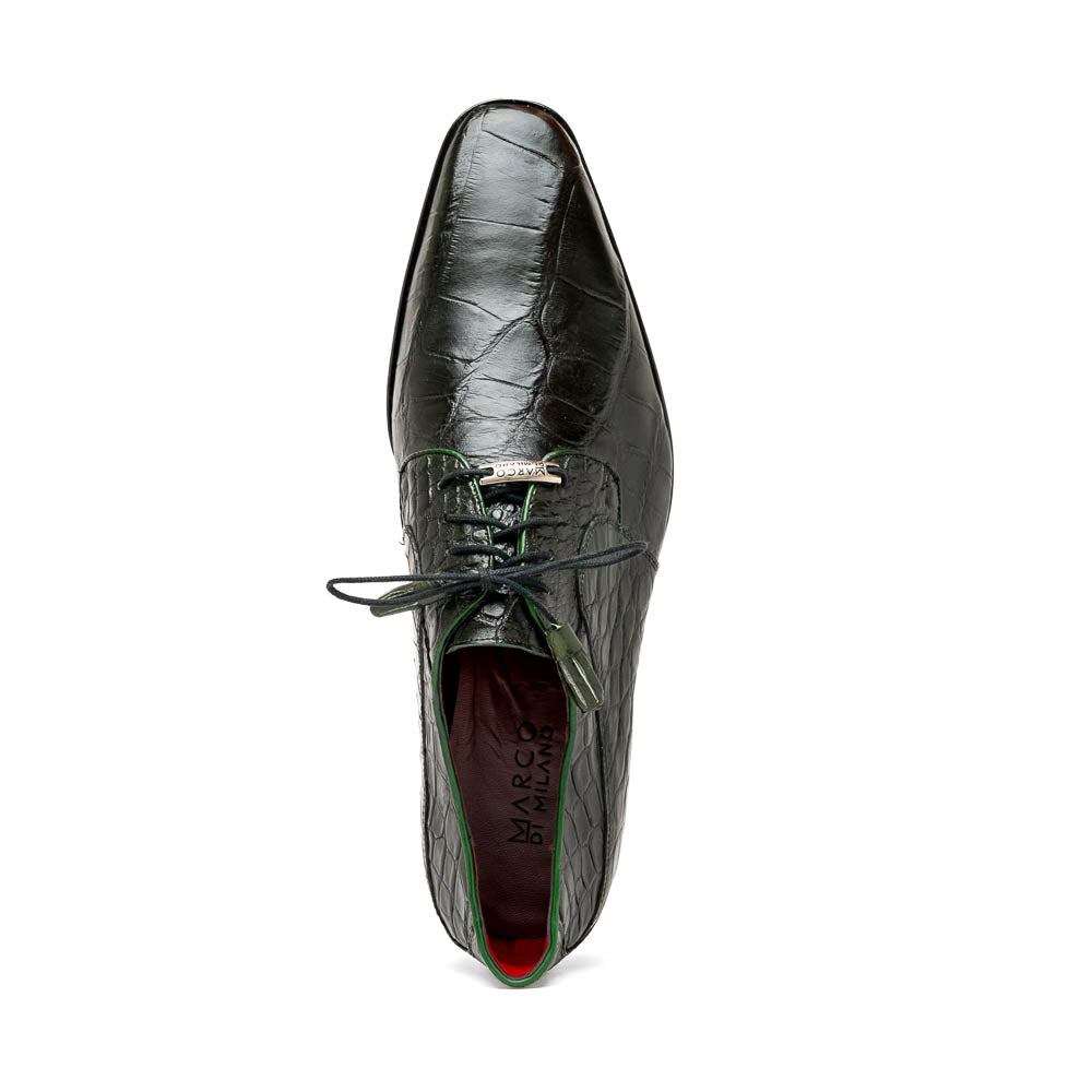 A pair of Fitipaldi Olive luxury footwear by Marco Di Milano in black crocodile leather—one shoe upright, the other showing a tan sole with "Marco Di Milano" embossed—crafted with hand-painted finishes for an elegant touch.